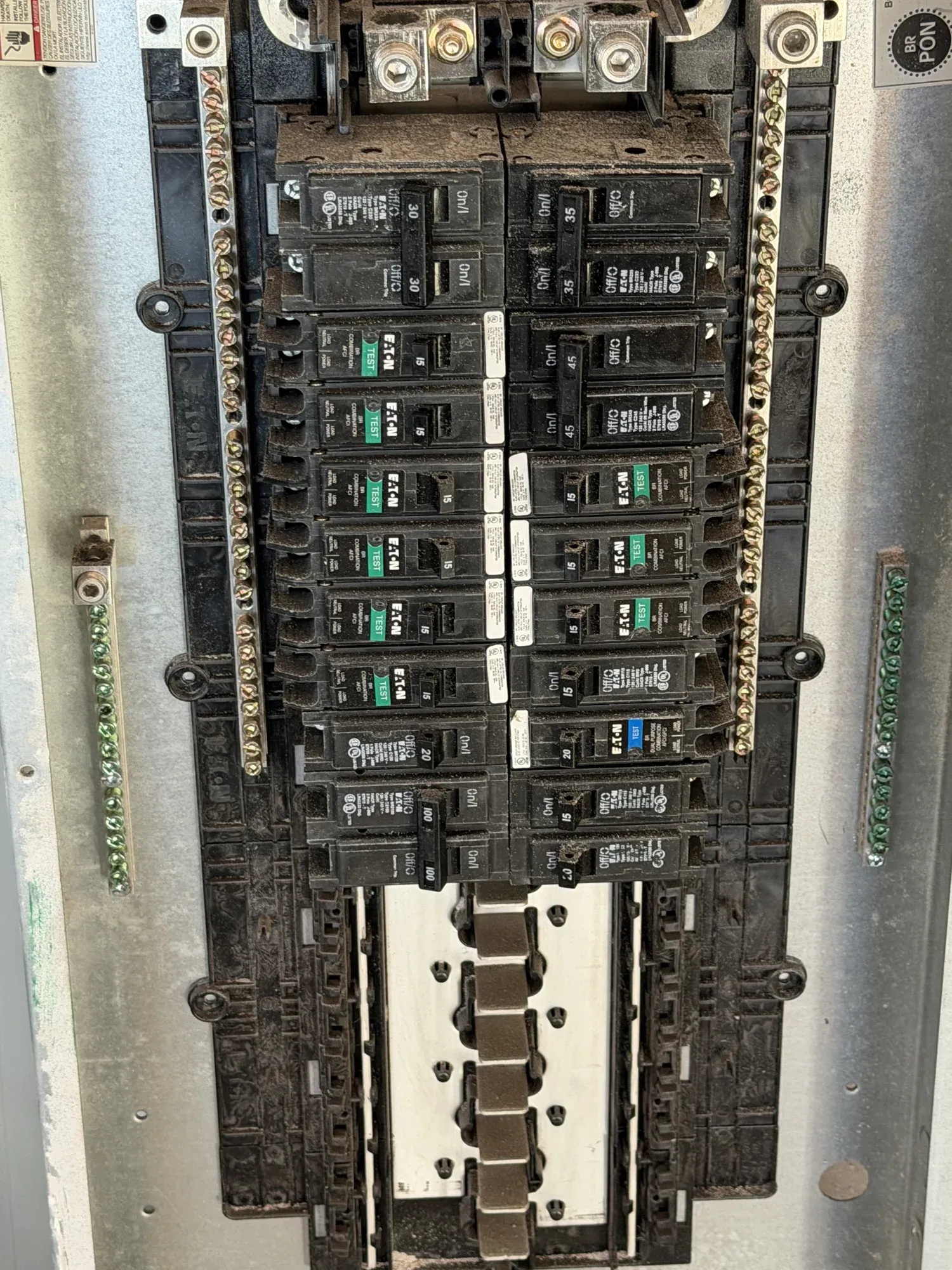 Old, worn electrical panel with the cover off, ready to be replaced